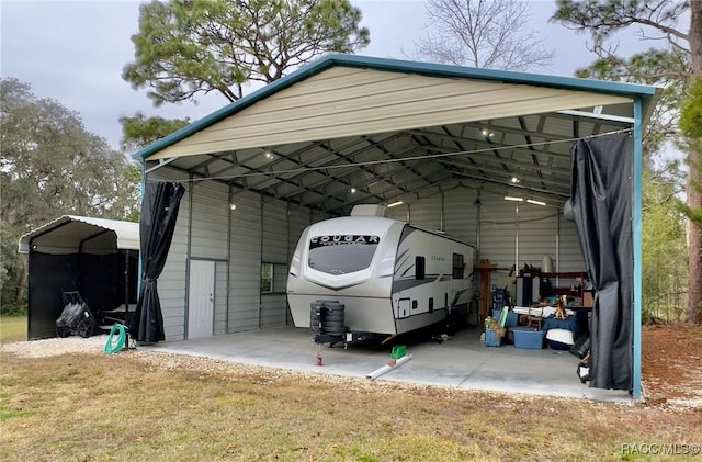 view of vehicle parking with a carport