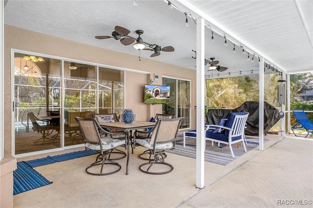 sunroom / solarium with ceiling fan