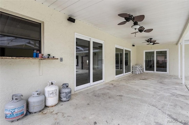 view of patio featuring ceiling fan