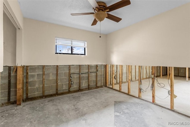 unfurnished room with concrete flooring and ceiling fan