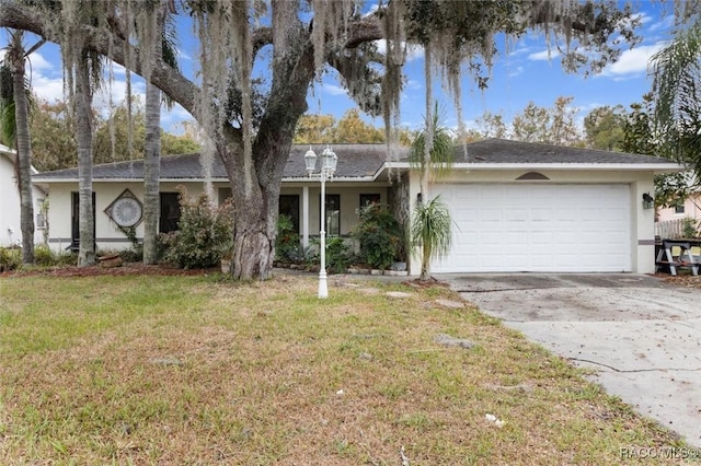 ranch-style home featuring a garage and a front yard