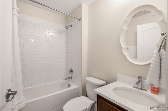 full bath featuring shower / bath combo with shower curtain, toilet, and vanity