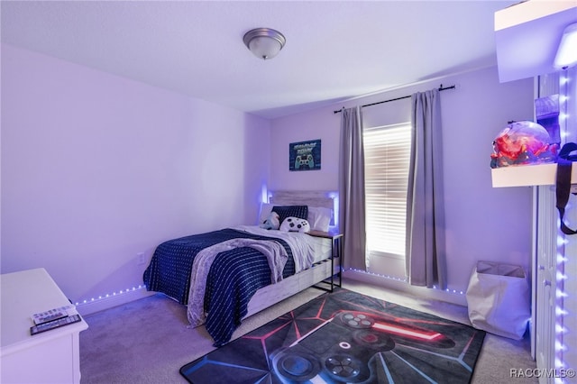 carpeted bedroom with baseboards