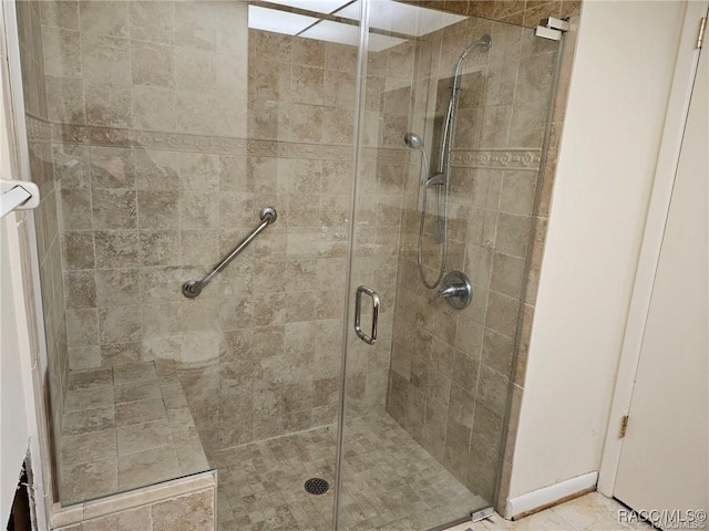 full bathroom featuring a stall shower