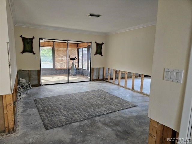 unfurnished room featuring ornamental molding, visible vents, and unfinished concrete floors