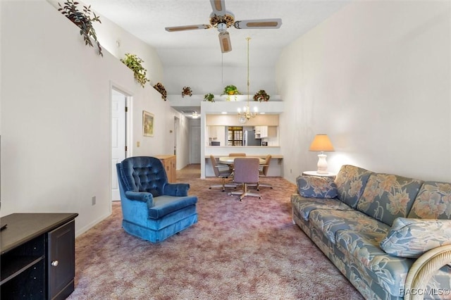 living area with carpet, a high ceiling, and ceiling fan with notable chandelier