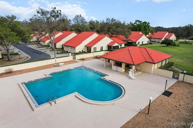 community pool with a residential view, a patio, a gazebo, and fence