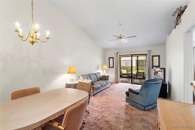 living room featuring lofted ceiling, ceiling fan with notable chandelier, and carpet