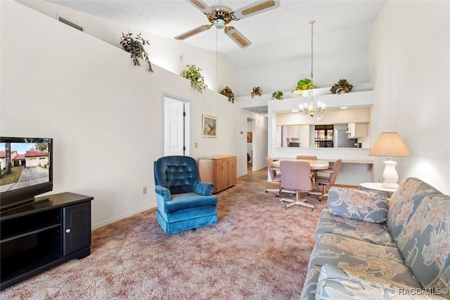 carpeted living area with visible vents, high vaulted ceiling, baseboards, and ceiling fan with notable chandelier