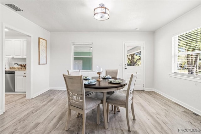 dining room featuring light hardwood / wood-style floors