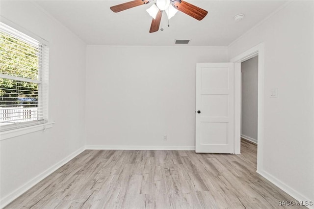 spare room with ceiling fan and light hardwood / wood-style floors