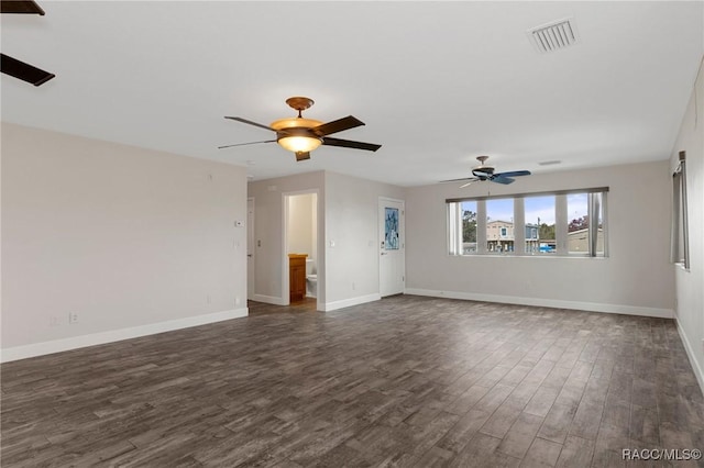 unfurnished living room featuring ceiling fan and dark hardwood / wood-style floors