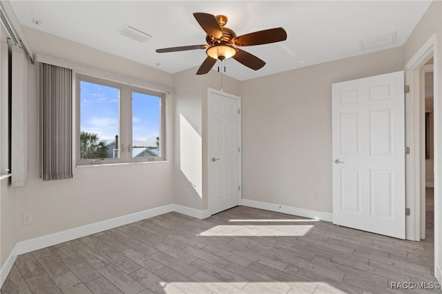 unfurnished bedroom with light hardwood / wood-style floors and ceiling fan