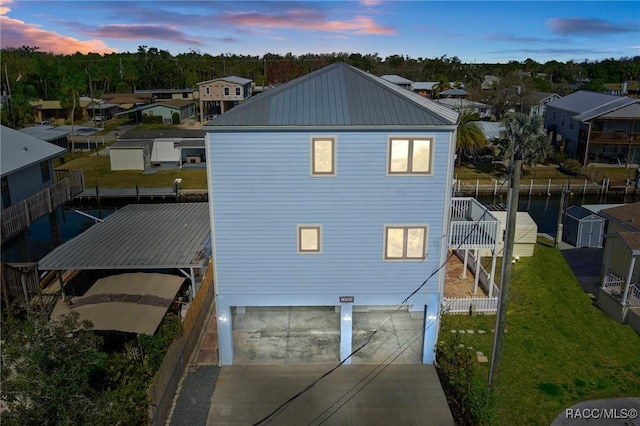 property exterior at dusk featuring a garage