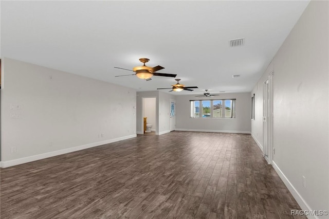 unfurnished living room featuring dark hardwood / wood-style flooring