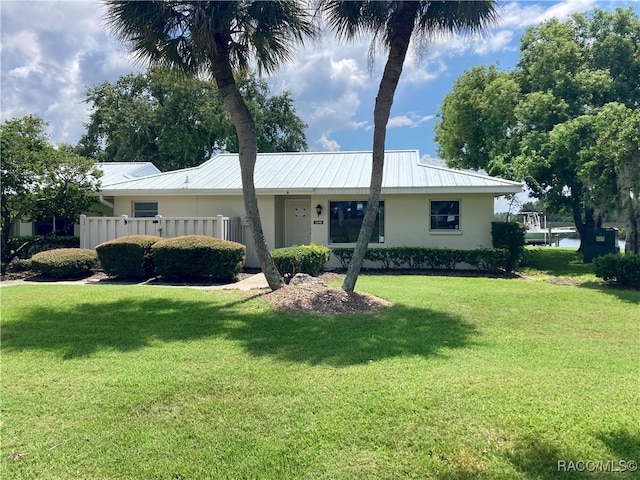 ranch-style home with a front yard