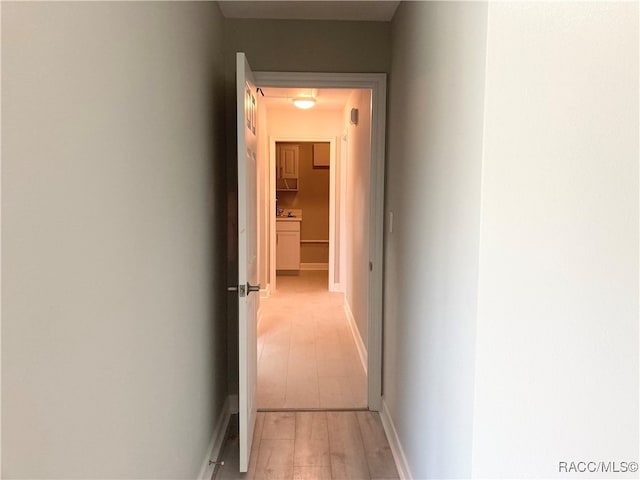 hallway featuring light wood-type flooring