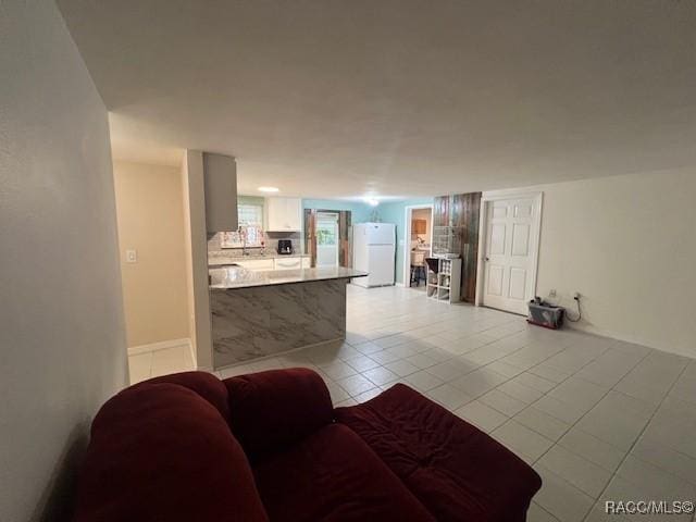 living room with light tile patterned floors