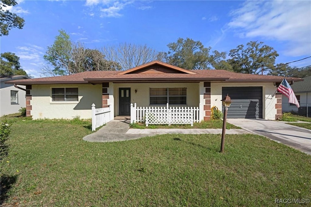 510 Hudson St, Inverness, FL 34452 - ranch-style house with a front lawn and a garage