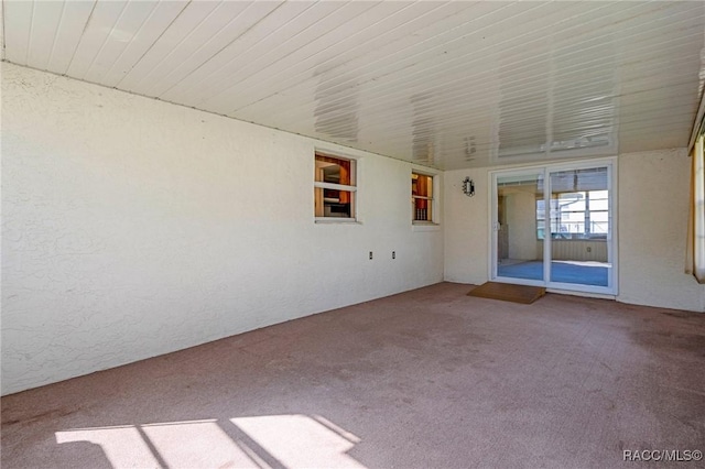 unfurnished room featuring carpet floors