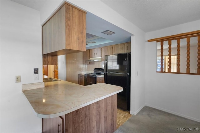 kitchen with tasteful backsplash, black appliances, a raised ceiling, light carpet, and kitchen peninsula