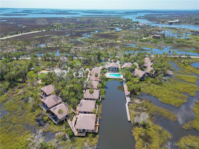 drone / aerial view featuring a residential view and a water view