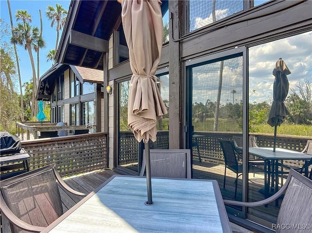wooden deck with outdoor dining area