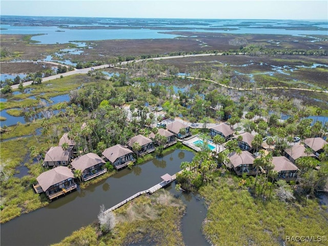 birds eye view of property with a water view and a residential view