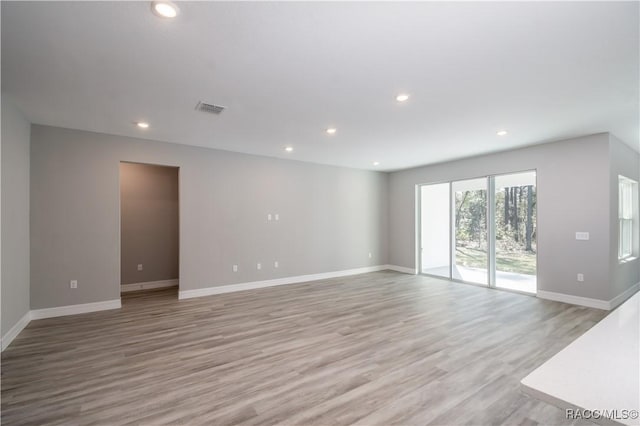 spare room featuring light hardwood / wood-style floors