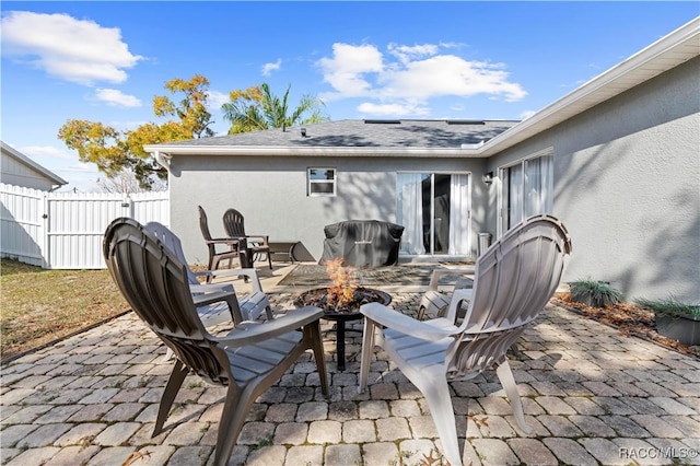 view of patio / terrace featuring a fire pit