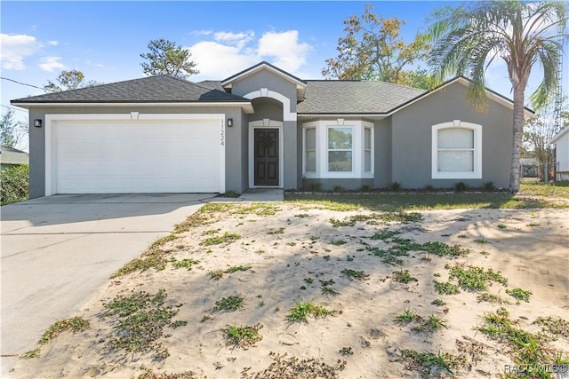 single story home featuring a garage