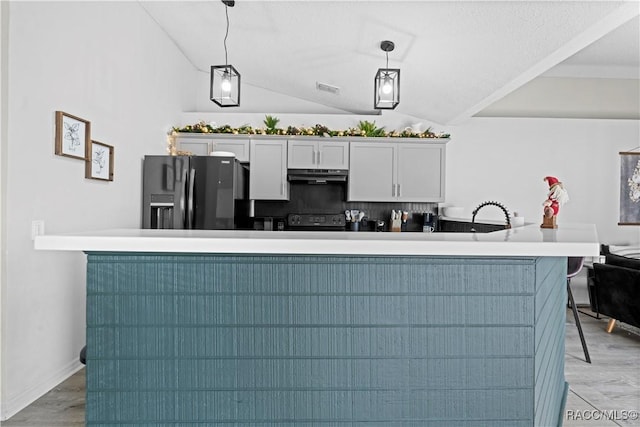 kitchen with electric range, fridge with ice dispenser, white cabinetry, hanging light fixtures, and lofted ceiling