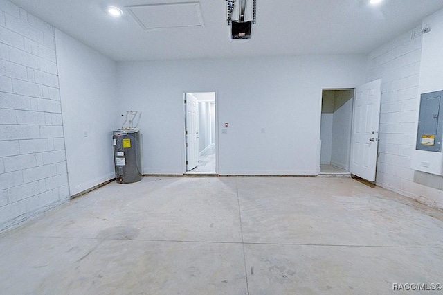 garage with electric panel, a garage door opener, and water heater