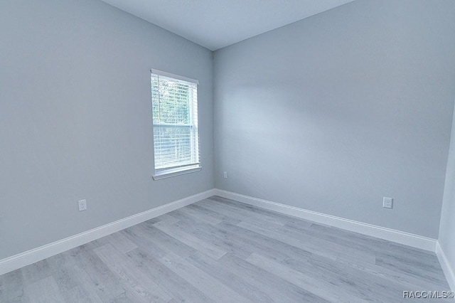 spare room with light hardwood / wood-style floors