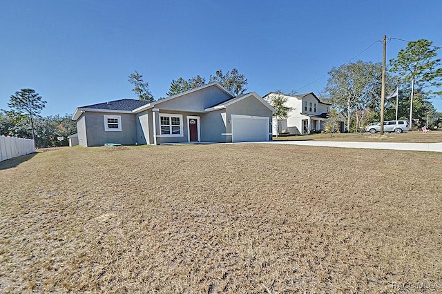 single story home featuring a garage