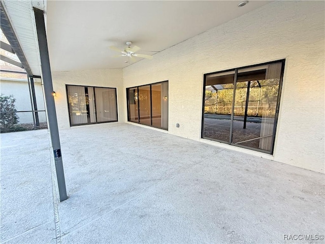 view of patio featuring ceiling fan