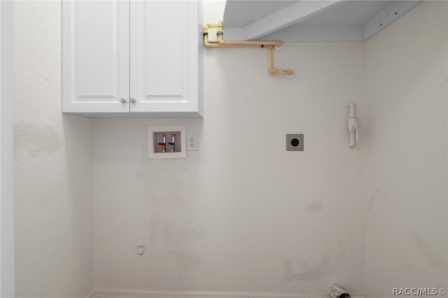 laundry room featuring electric dryer hookup, cabinets, washer hookup, and gas dryer hookup