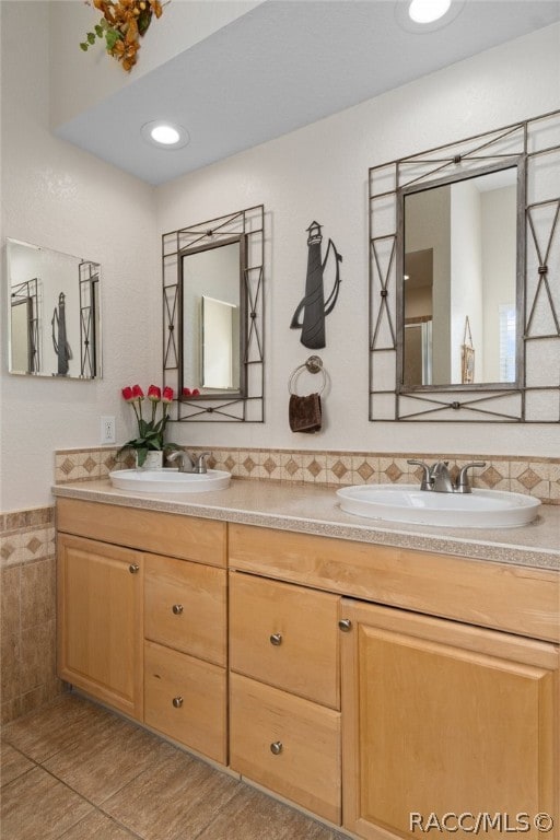 bathroom with tile patterned flooring and vanity