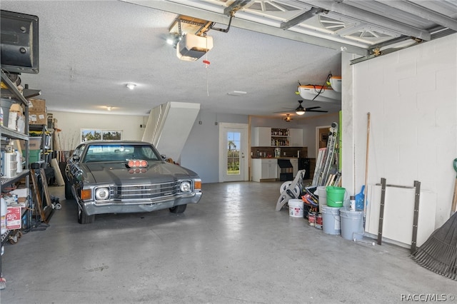 garage featuring a garage door opener and ceiling fan