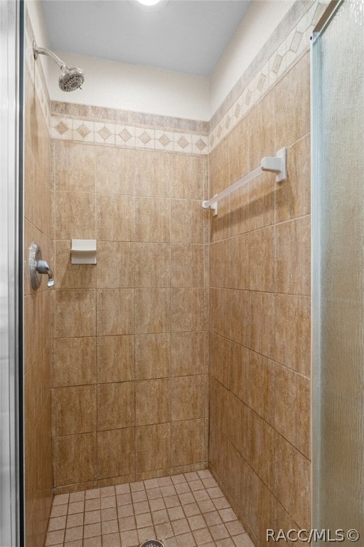 bathroom with a tile shower