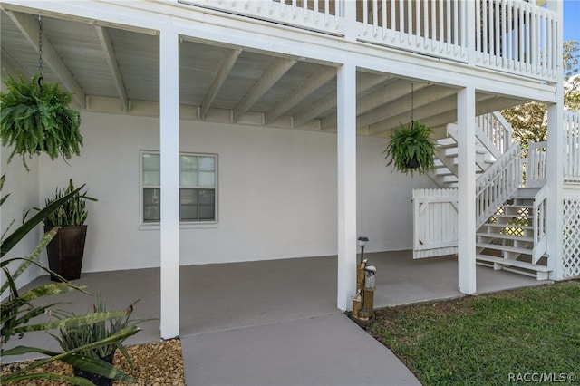 property entrance featuring a patio area