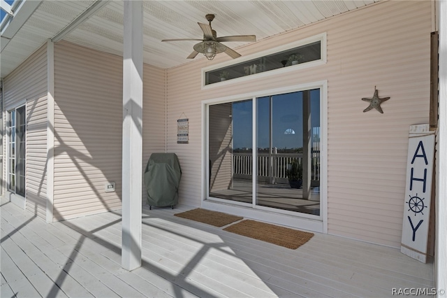 deck with ceiling fan and a grill