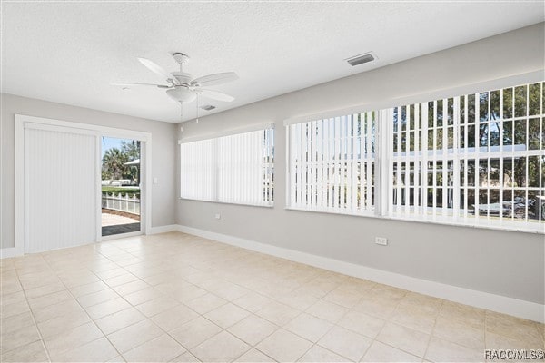 3929 N Sagomon Pt, Crystal River, FL 34428 - spare room featuring ceiling fan, a textured ceiling, and light tile patterned floors