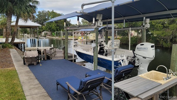 3929 N Sagomon Pt, Crystal River, FL 34428 - dock area featuring boat lift and a water view
