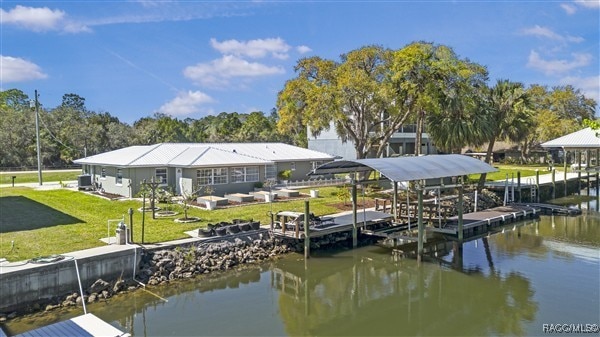 3929 N Sagomon Pt, Crystal River, FL 34428 - dock area with a water view and a lawn
