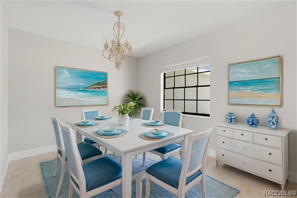 3929 N Sagomon Pt, Crystal River, FL 34428 - dining area featuring a chandelier and baseboards