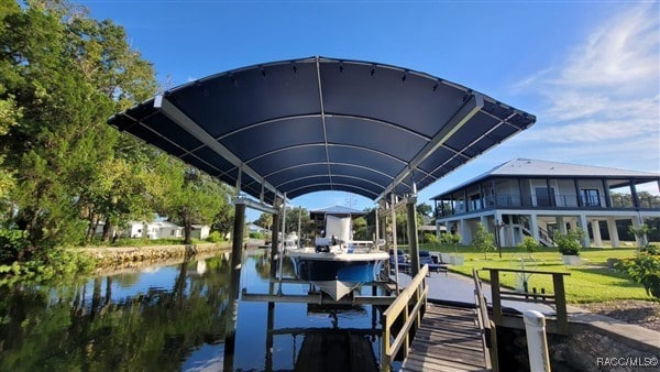 3929 N Sagomon Pt, Crystal River, FL 34428 - dock area featuring boat lift and a water view