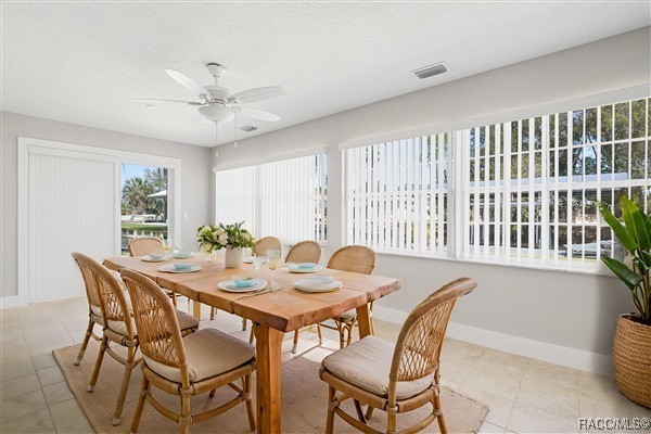3929 N Sagomon Pt, Crystal River, FL 34428 - dining space featuring light tile patterned floors and ceiling fan