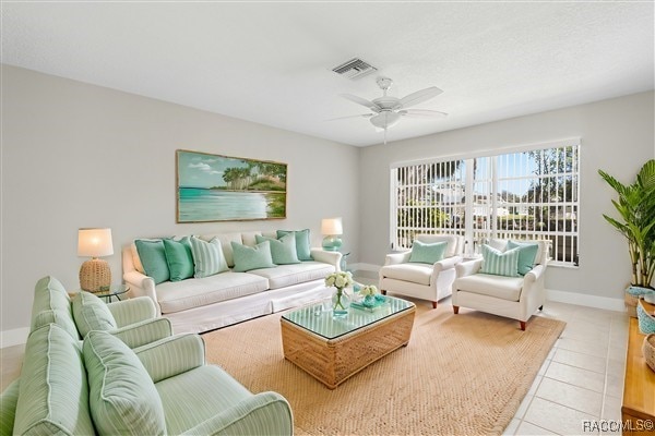 3929 N Sagomon Pt, Crystal River, FL 34428 - living area featuring ceiling fan and light tile patterned flooring