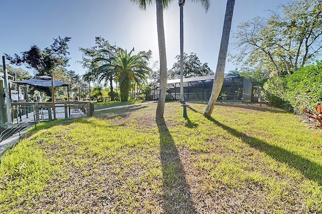 view of yard with a lanai